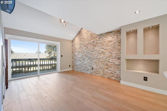 7752 SW Barnes Rd Unit B, Portland, OR 97225 - spare room featuring baseboards, wood finished floors, lofted ceiling, and recessed lighting
