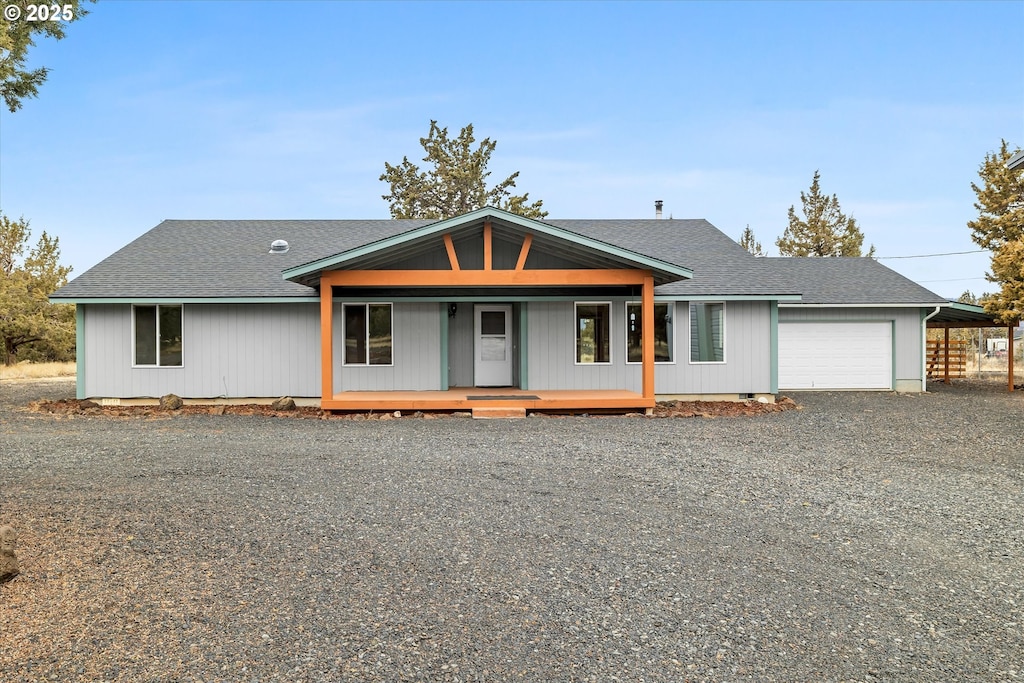 view of front of house with a garage and a porch