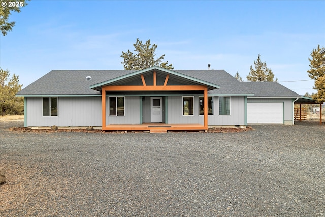 view of front of house with a garage and a porch