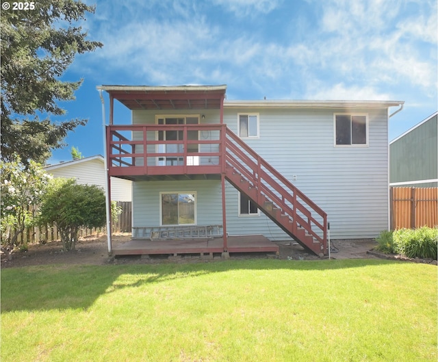 back of house with a wooden deck and stairs