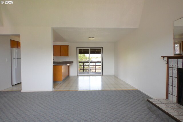 unfurnished living room with light carpet