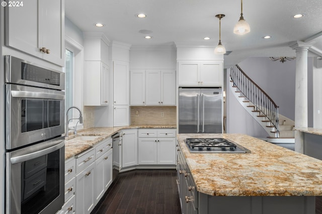 kitchen featuring dark wood finished floors, white cabinets, stainless steel appliances, and recessed lighting