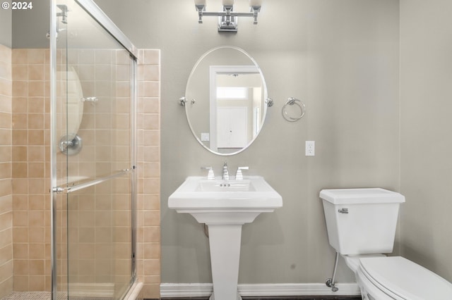 full bathroom with toilet and a stall shower