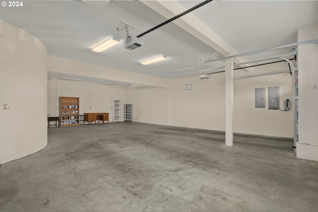 garage featuring a garage door opener and electric panel