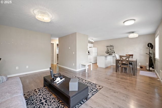 5582 SW Murray Blvd, Beaverton, OR 97005 - living area featuring baseboards and light wood-style flooring