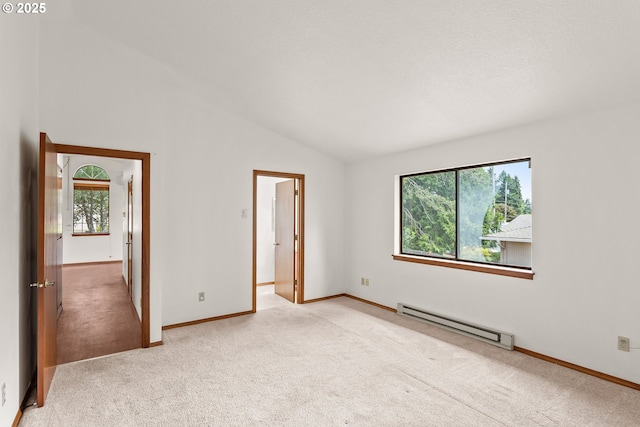 15210 SW 100th Ave, Portland, OR 97224 - unfurnished bedroom featuring baseboard heating, light colored carpet, and lofted ceiling