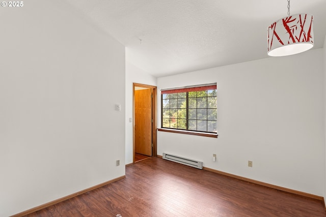 15210 SW 100th Ave, Portland, OR 97224 - spare room featuring baseboard heating, wood finished floors, and vaulted ceiling