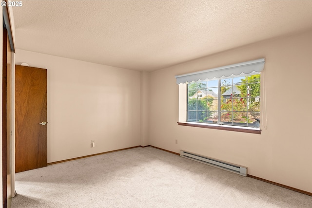 15210 SW 100th Ave, Portland, OR 97224 - spare room with a baseboard heating unit, carpet floors, and a textured ceiling