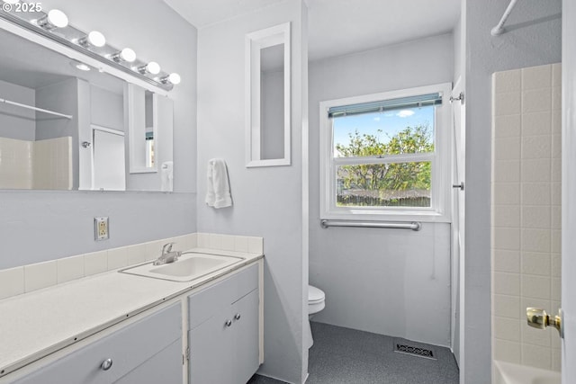 full bath featuring vanity, toilet, tub / shower combination, and visible vents