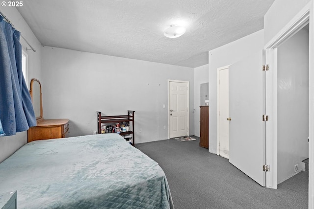 carpeted bedroom with a textured ceiling