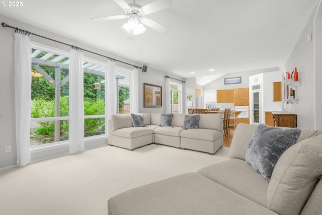 living area featuring ceiling fan, light carpet, recessed lighting, and lofted ceiling