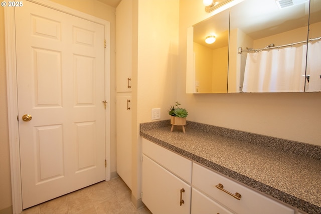 doorway featuring light tile patterned floors