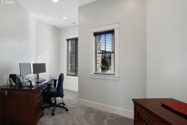 office featuring recessed lighting, visible vents, baseboards, and light colored carpet