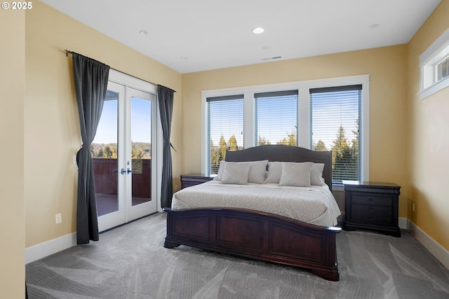 bedroom featuring access to outside, light colored carpet, and baseboards