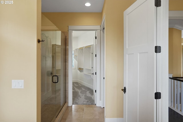 full bathroom featuring recessed lighting and a shower stall