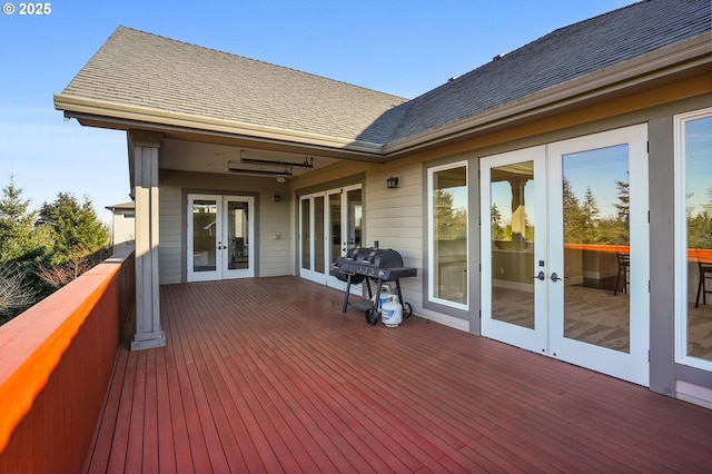 deck with area for grilling and french doors