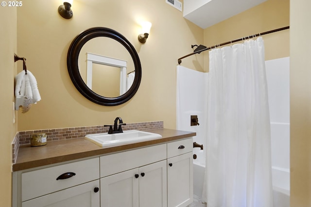 full bathroom featuring tasteful backsplash, visible vents, shower / bath combination with curtain, and vanity