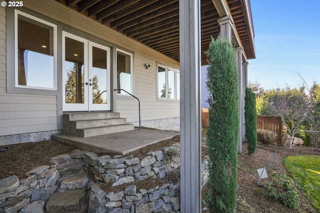 exterior space with entry steps and french doors