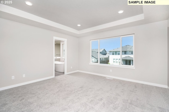 8900 S 1st St Unit 17, Ridgefield, WA 98642 - spare room featuring carpet flooring, a raised ceiling, and recessed lighting