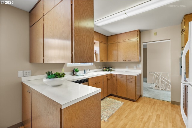 1810 D St, Forest Grove, OR 97116 - kitchen with a sink, light countertops, light wood finished floors, a peninsula, and dishwasher