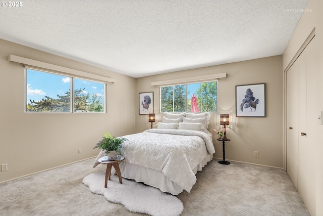 1810 D St, Forest Grove, OR 97116 - bedroom with light colored carpet, a closet, a textured ceiling, and baseboards