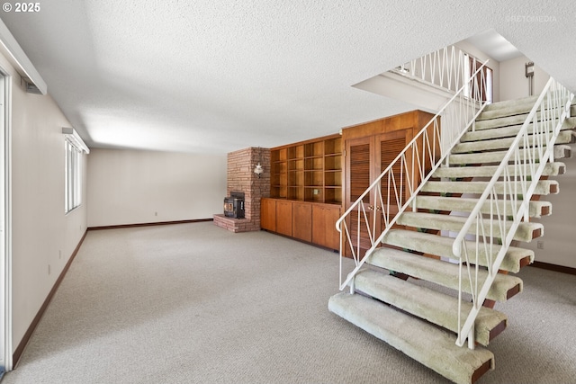 1810 D St, Forest Grove, OR 97116 - stairway with baseboards, carpet flooring, a textured ceiling, and a fireplace