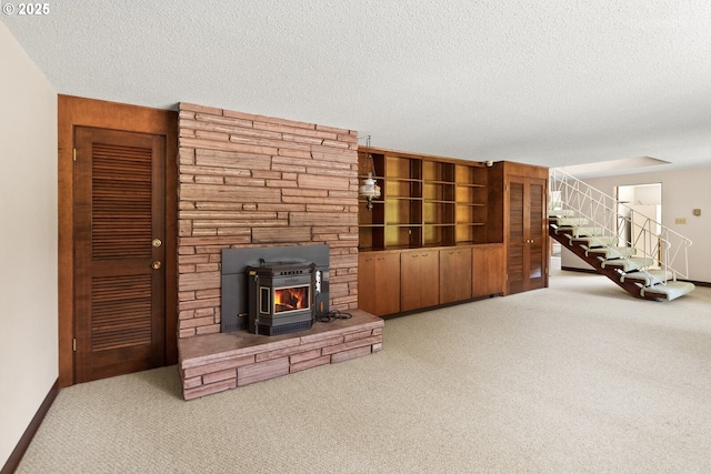 1810 D St, Forest Grove, OR 97116 - unfurnished living room featuring stairway, carpet floors, a textured ceiling, and baseboards