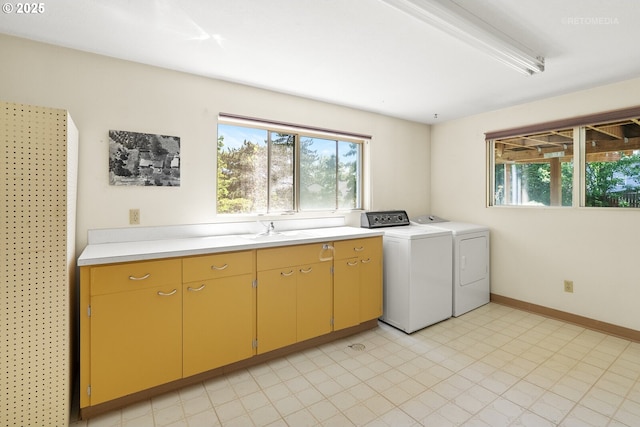 1810 D St, Forest Grove, OR 97116 - laundry room with washer and clothes dryer, plenty of natural light, a sink, and baseboards