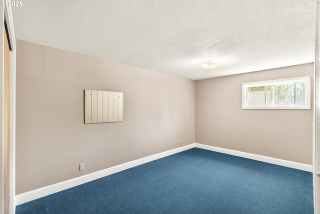 1810 D St, Forest Grove, OR 97116 - empty room with carpet floors, baseboards, and a textured ceiling