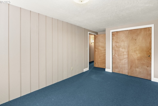 1810 D St, Forest Grove, OR 97116 - unfurnished bedroom with carpet floors, a textured ceiling, and a closet