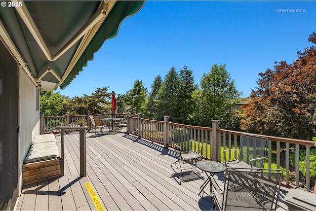 1810 D St, Forest Grove, OR 97116 - wooden deck featuring outdoor dining space and view of scattered trees