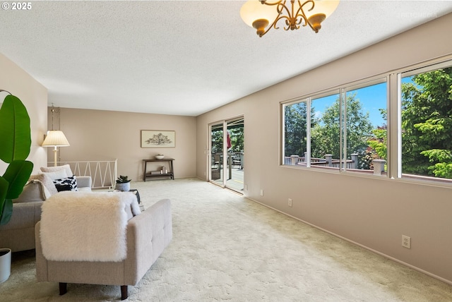 1810 D St, Forest Grove, OR 97116 - carpeted living area with a chandelier, baseboards, and a textured ceiling