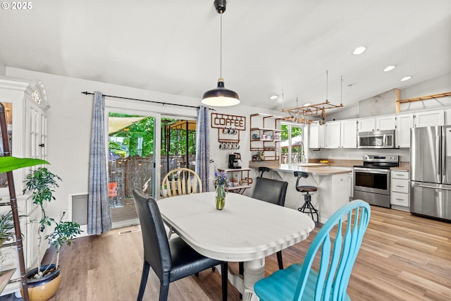 kitchen with stainless steel appliances, a sink, recessed lighting, white cabinetry, and light countertops