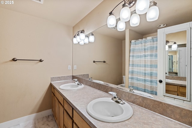 full bath featuring a wainscoted wall, vanity, toilet, and shower / tub combo