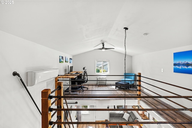 home office with vaulted ceiling, ceiling fan, and wood finished floors