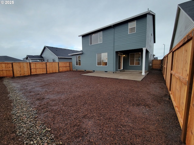 back of house with a patio area and a fenced backyard