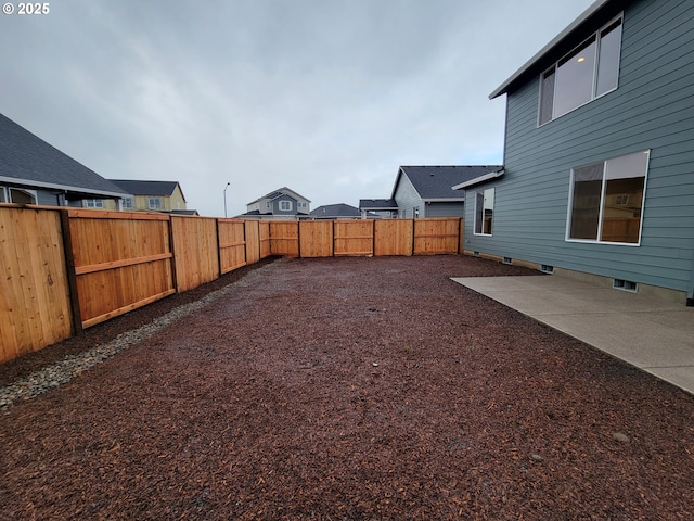 view of yard featuring a fenced backyard and a patio