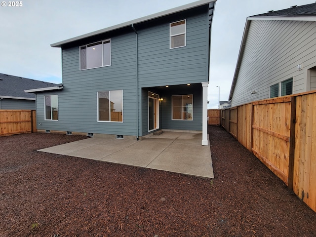 back of house with a patio and a fenced backyard