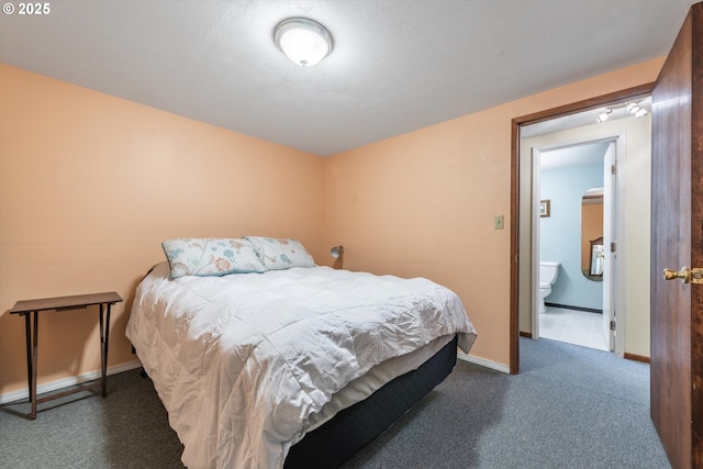 carpeted bedroom with baseboards