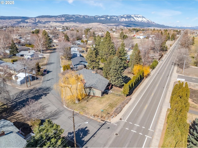 birds eye view of property featuring a mountain view and a residential view