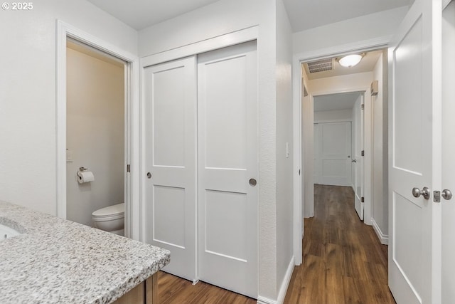 6841 SW Sussex St, Beaverton, OR 97008 - hallway with dark wood-style flooring and baseboards