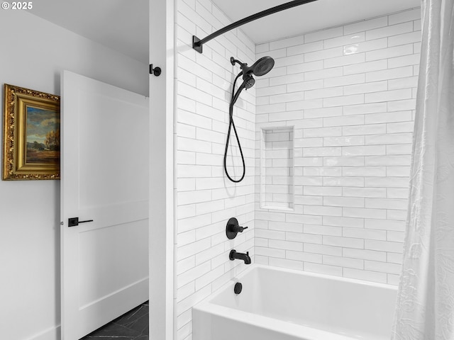 bathroom featuring marble finish floor and shower / tub combo