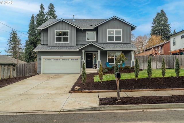 view of front of house featuring a front lawn and a garage