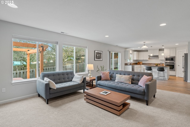 living room with light colored carpet