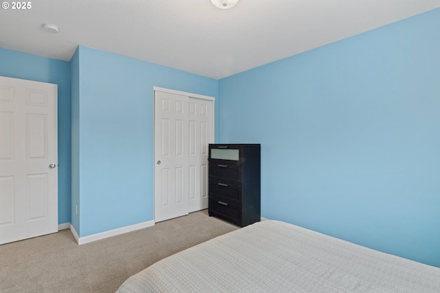 carpeted bedroom featuring a closet