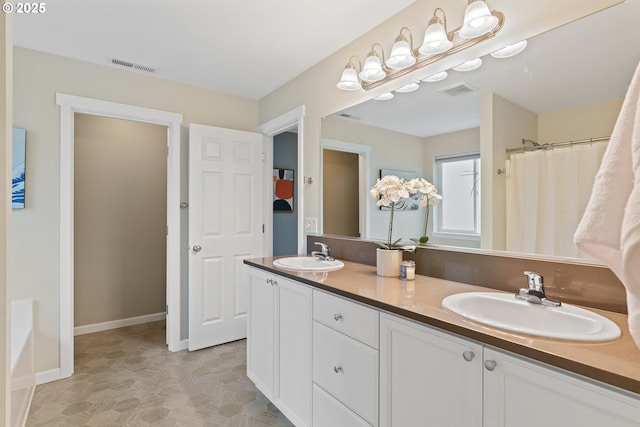 bathroom featuring walk in shower and vanity