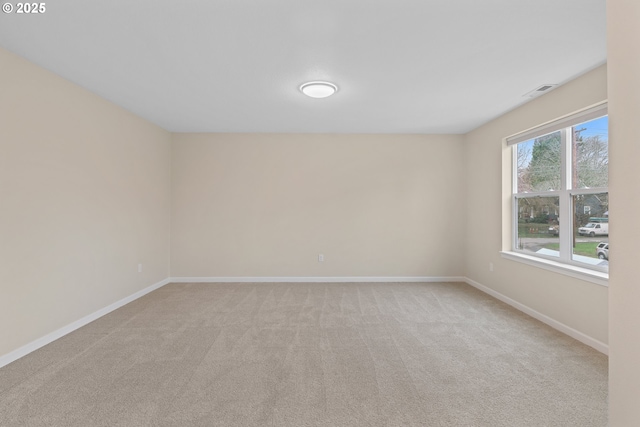 spare room with light carpet