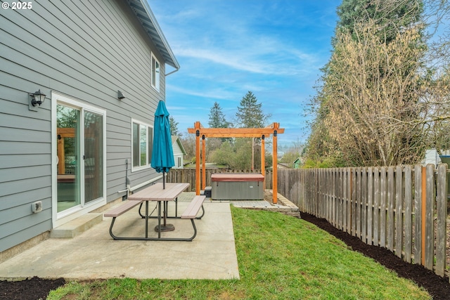 view of yard with a hot tub and a patio area