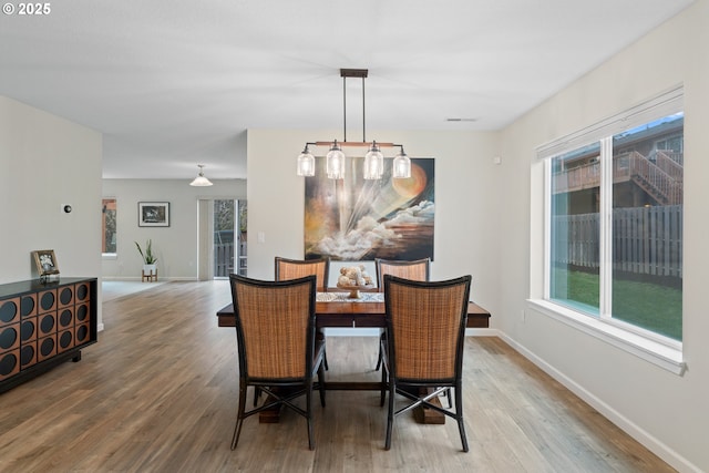 dining area featuring hardwood / wood-style floors