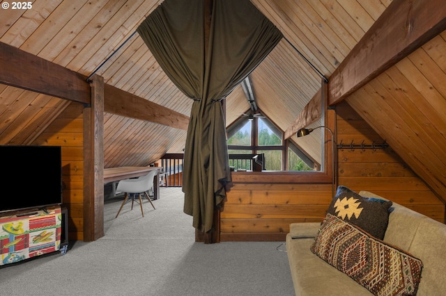 interior space with lofted ceiling with beams, carpet, wood walls, and wooden ceiling